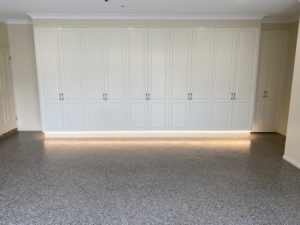 Fitout garage cabinetry with lighting in Biscuit